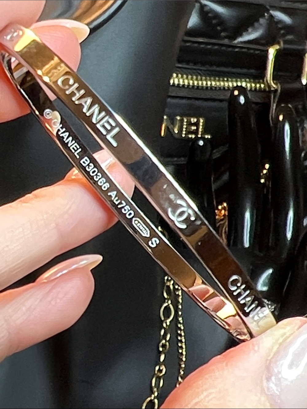 Gold-Tone Engraved Logo Bangle Bracelet in Gold and Black